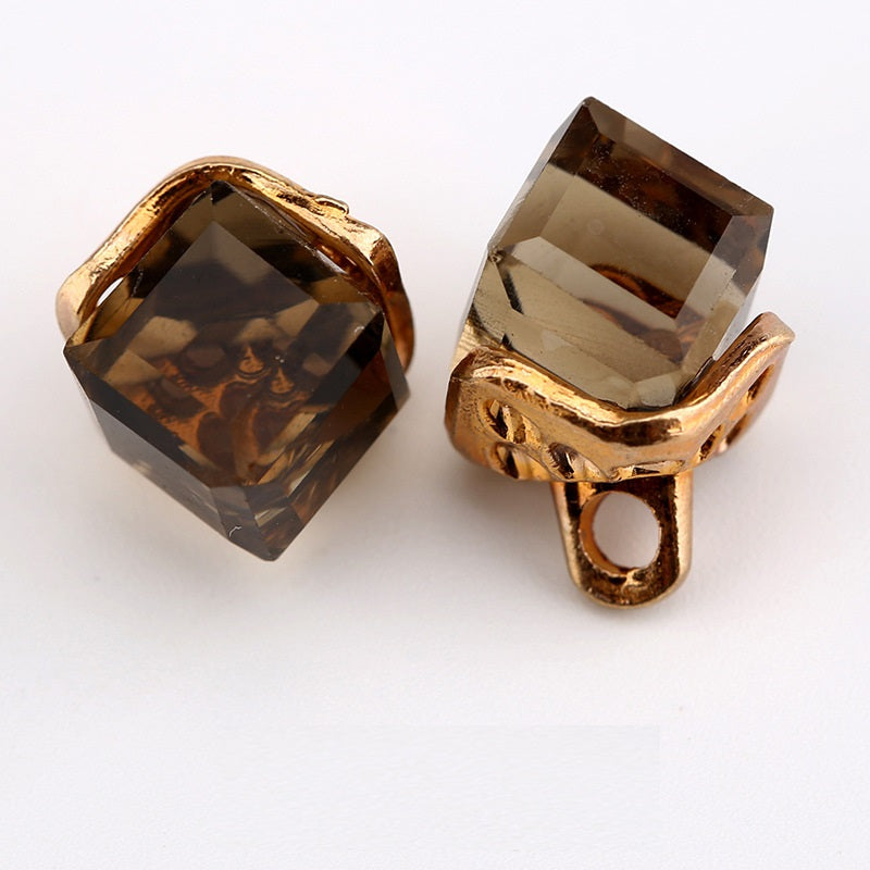 Square crystal mini buttons, smoky brown with gold-tone setting, 2 visible