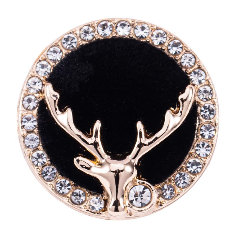 Golden deer head metal shank button with black center and crystal-studded rim