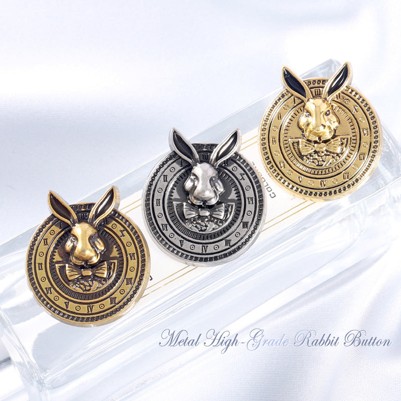 Gold-tone rabbit-head metal coat button with black enamel ears, ornate clock-style rim