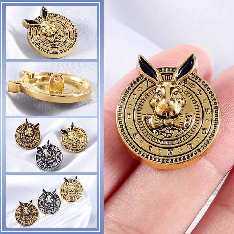 Gold-tone rabbit-head coat button with black enamel ears, round engraved border