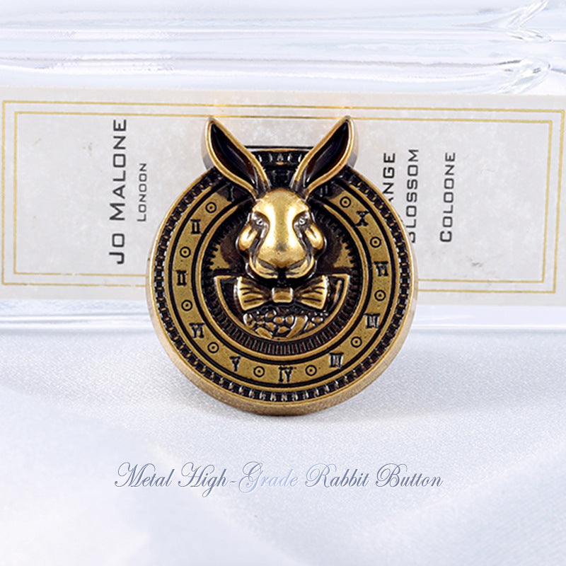 Bronze-tone rabbit-head coat button with black enamel ears and round engraved details