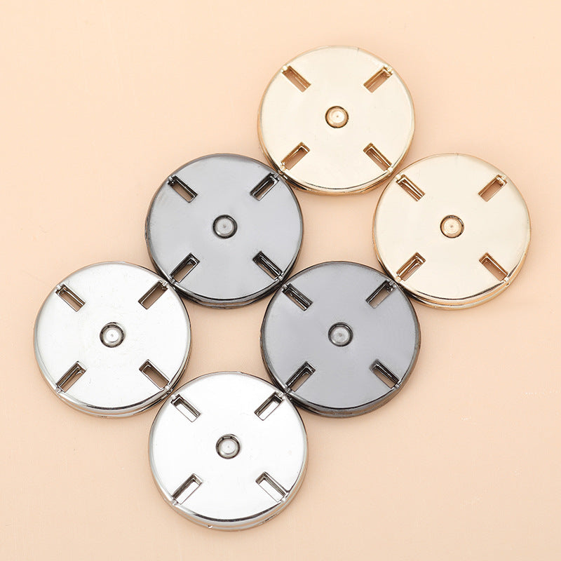 Round invisible snap buttons in mixed tones: gold, silver, and dark gun/black