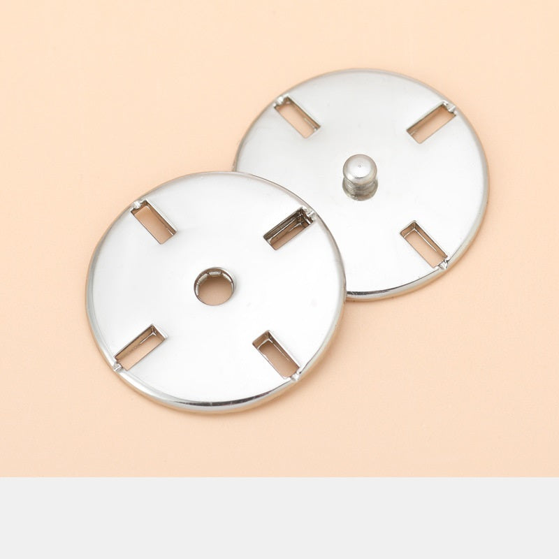 Two round metal invisible snap button discs with bar tabs and center post, silver tone