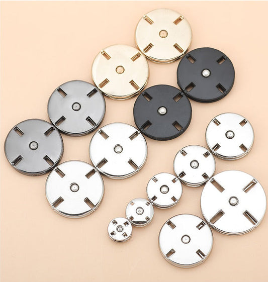 Set of round metal invisible snap buttons in mixed finishes: light silver, dark gun/black