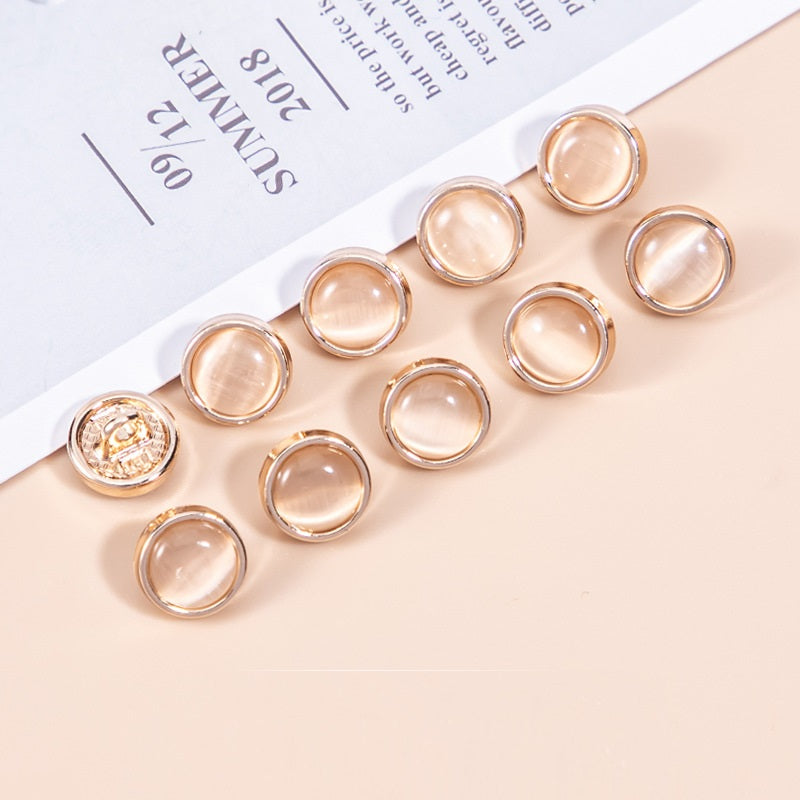 Shirt buttons with peach cat’s eye pearlescent stones, round metal frames