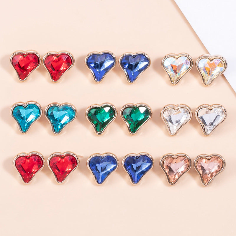 Assorted heart-shaped crystal metal shirt buttons, mixed red, blue, green, and clear styles
