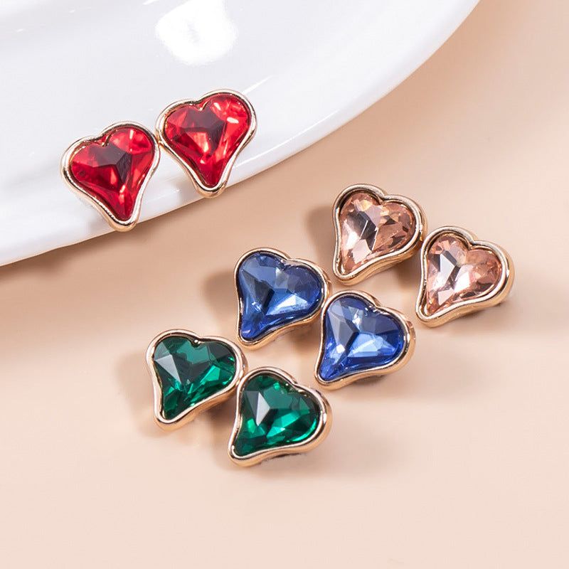 Heart-shaped crystal buttons: red, blue, green, and peach-pink colors with gold-tone edges