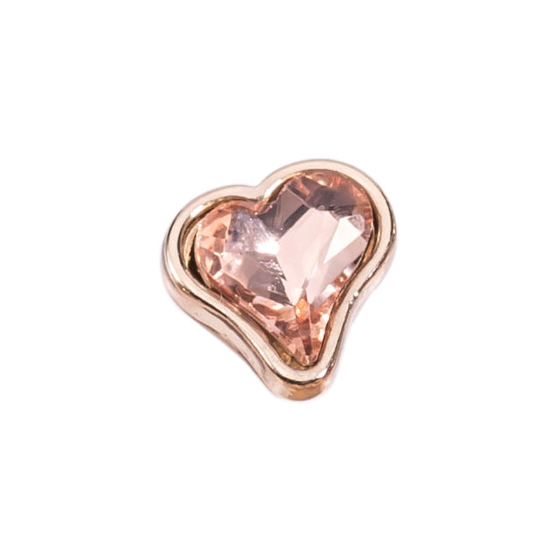 Single heart-shaped crystal metal button in peach-pink with gold-tone bezel