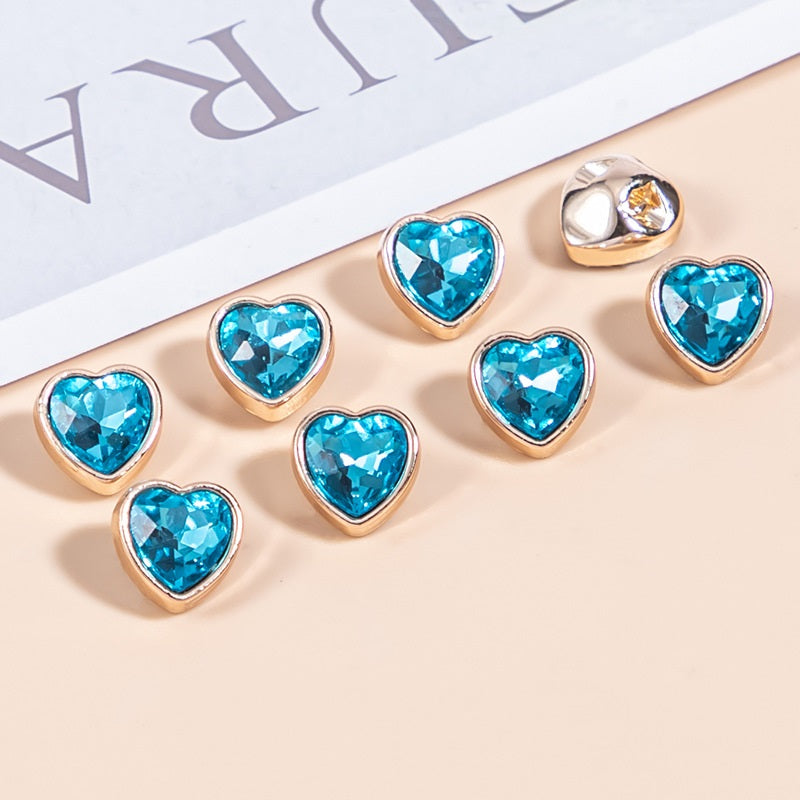 Aqua blue heart-shaped crystal shirt buttons, gold-tone metal frames, faceted stones