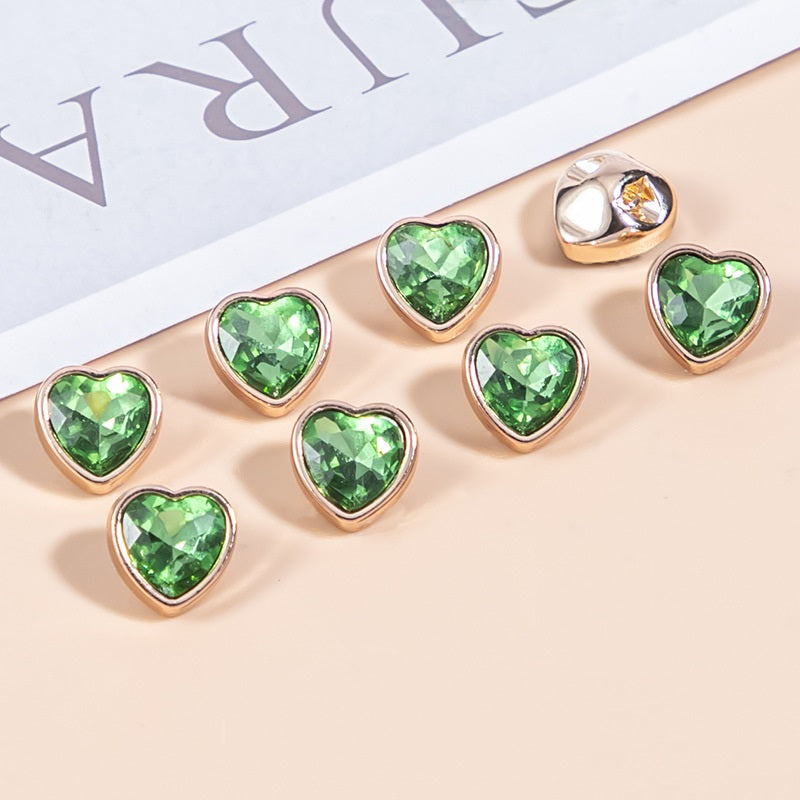 Light green heart-shaped crystal shirt buttons with gold-tone metal frames, faceted stones
