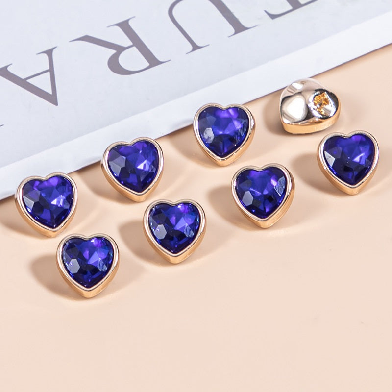 Blue heart-shaped crystal shirt buttons with gold-tone metal frames, faceted stones