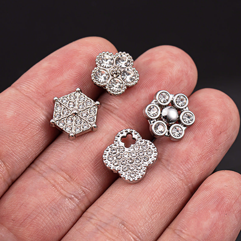 Silver rhinestone shirt buttons, round and square styles held in a hand