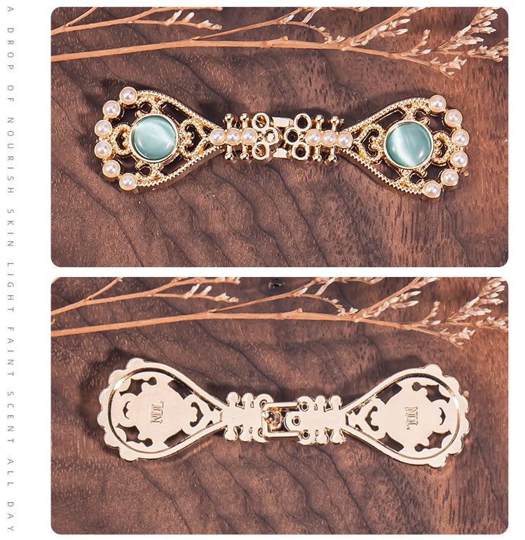 Pipa-shaped metal buttons with light blue oval stones, gold filigree and pearls