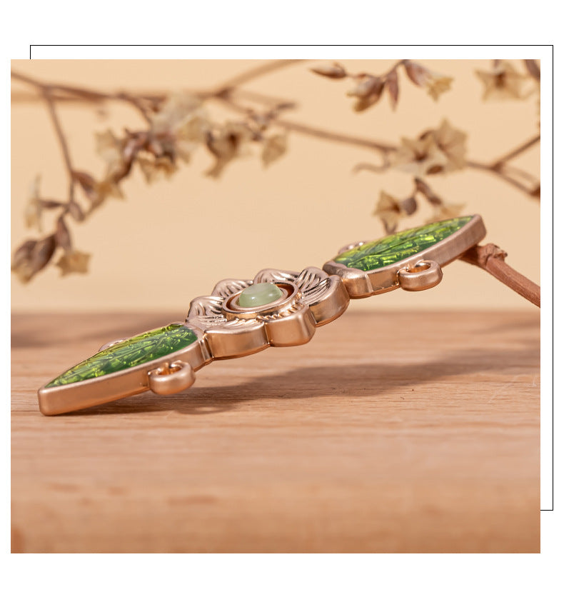Side view green cat’s eye leaf lock button with round center stone and metal loops