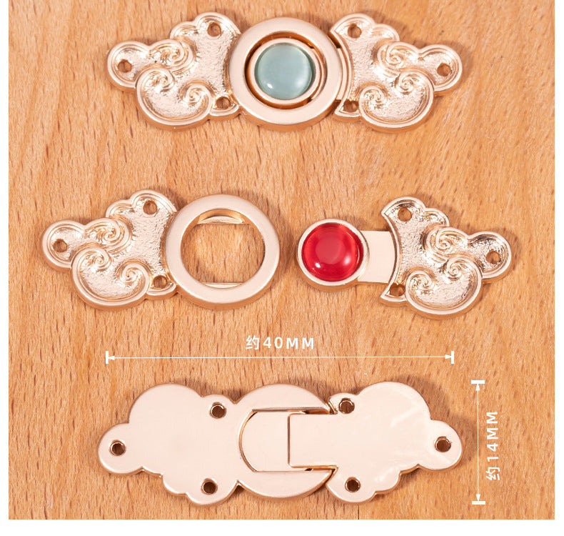 Metal cat’s-eye button set: cloud filigree plates with light-blue stone and red ring piece