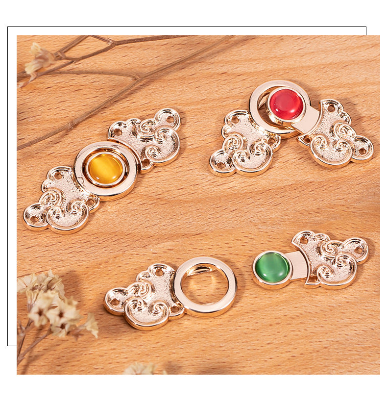 Assorted ornate metal cat’s-eye buttons with red, yellow, blue, green stones on display (8-pack)
