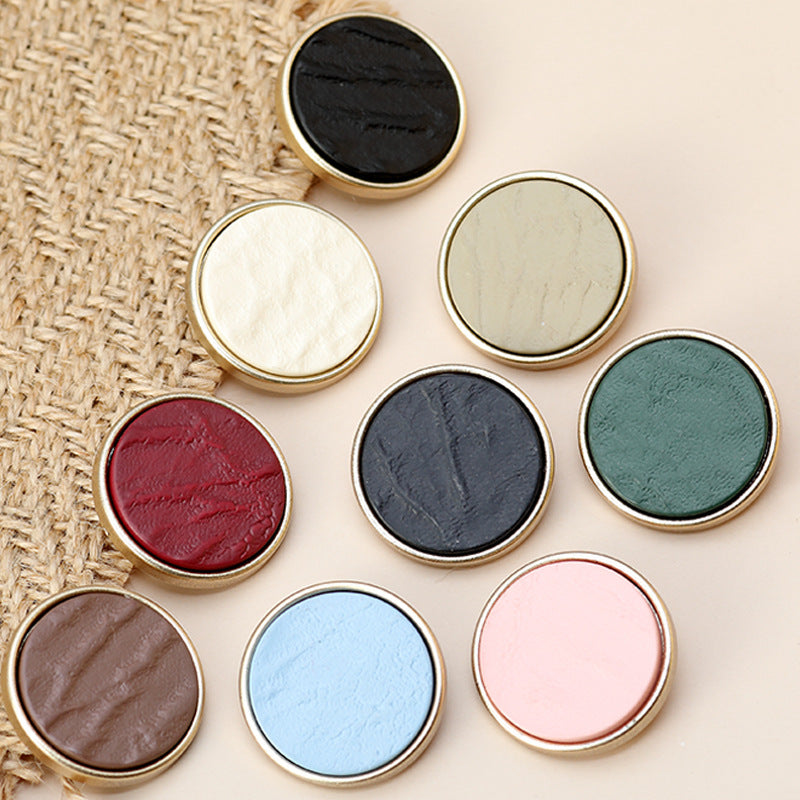 Assorted round resin metallic buttons with gold edges in black, blue, pink, brown, green