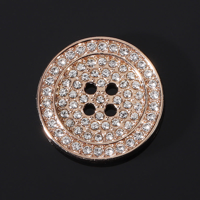 Round flat rhinestone metal button, rose-gold frame with clear stones and black 4-hole center