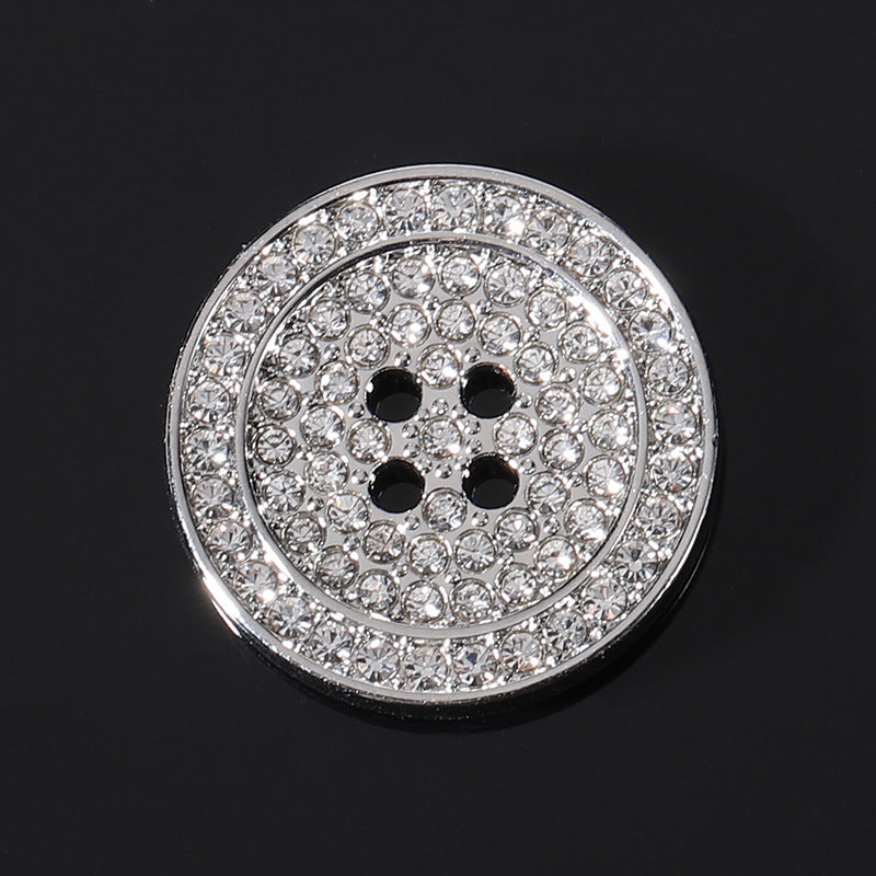 Round flat rhinestone metal button, silver frame with clear stones and black 4-hole center