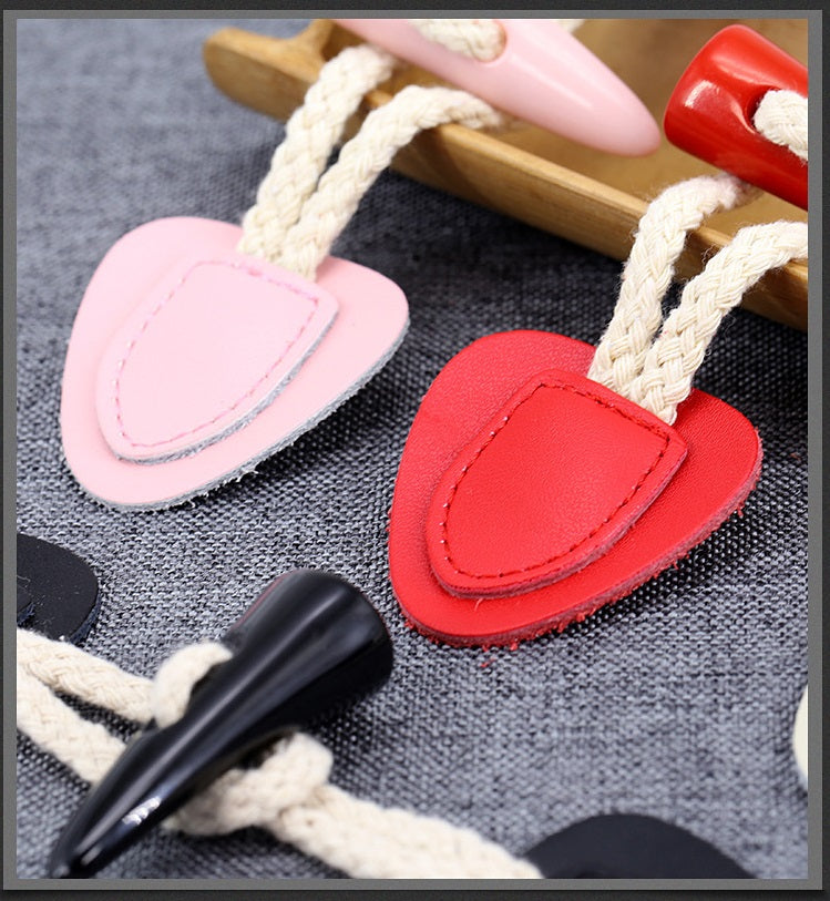 Leather horn toggle buttons in light pink and red, with black and cream pieces, 5 pcs