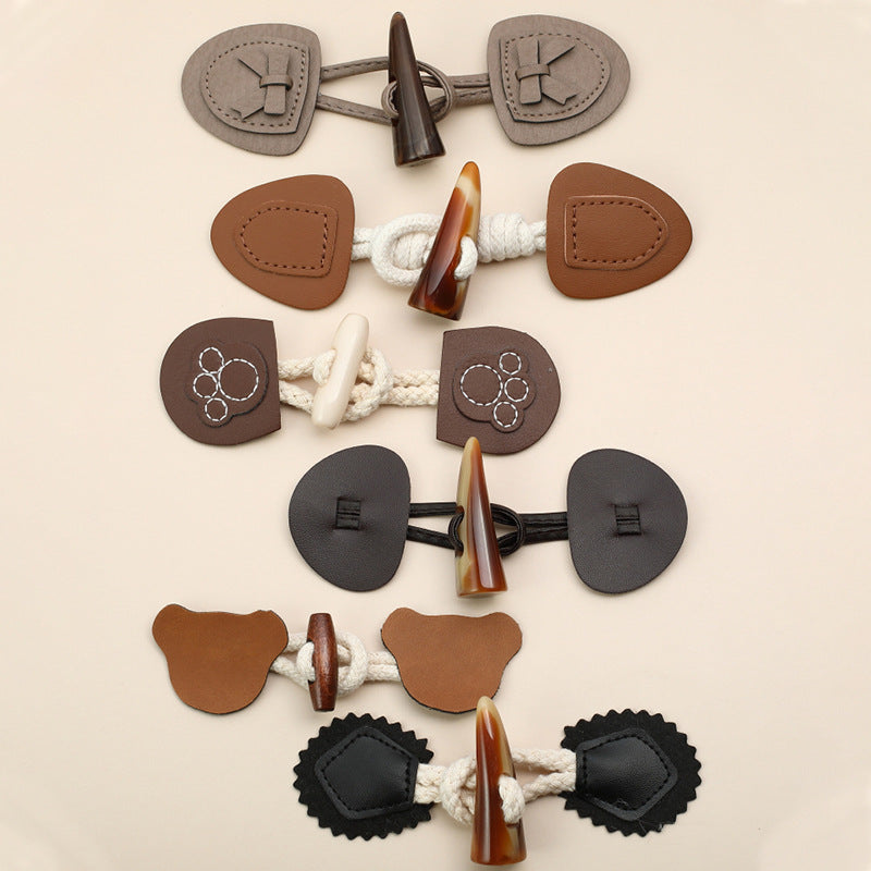 Leather and resin horn buttons assortment: brown, gray, black, and white on cord