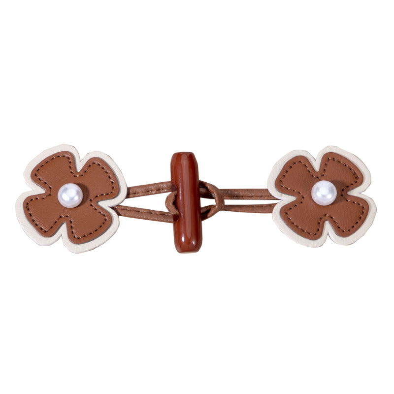 Brown faux leather flower toggle button with faux pearl center and matching strap
