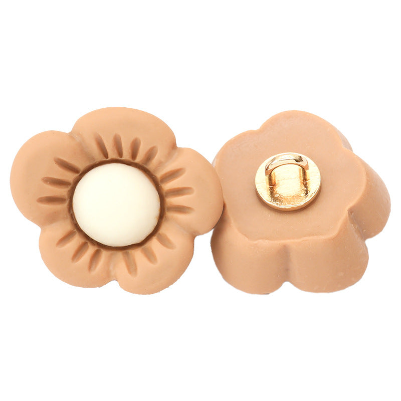 Two flower resin buttons in tan/brown with gold-tone metal shanks