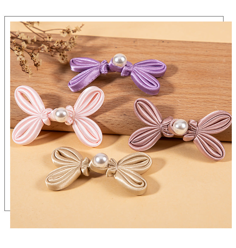 Lavender, pink, and gold bowknot pearl buttons with satin ribbon bows and pearl beads