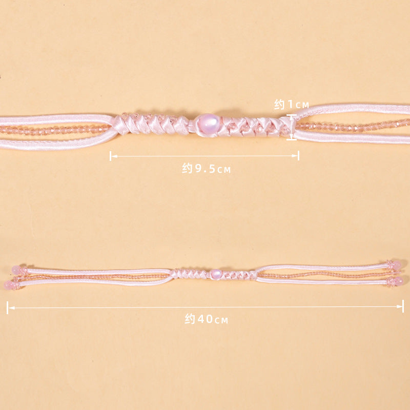 Pink snake-knot braided cord, about 40cm long, with crystal bead knot