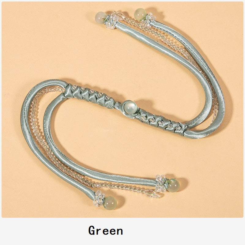 Green snake-knot braided cord set with crystal bead tips and satin knot detail