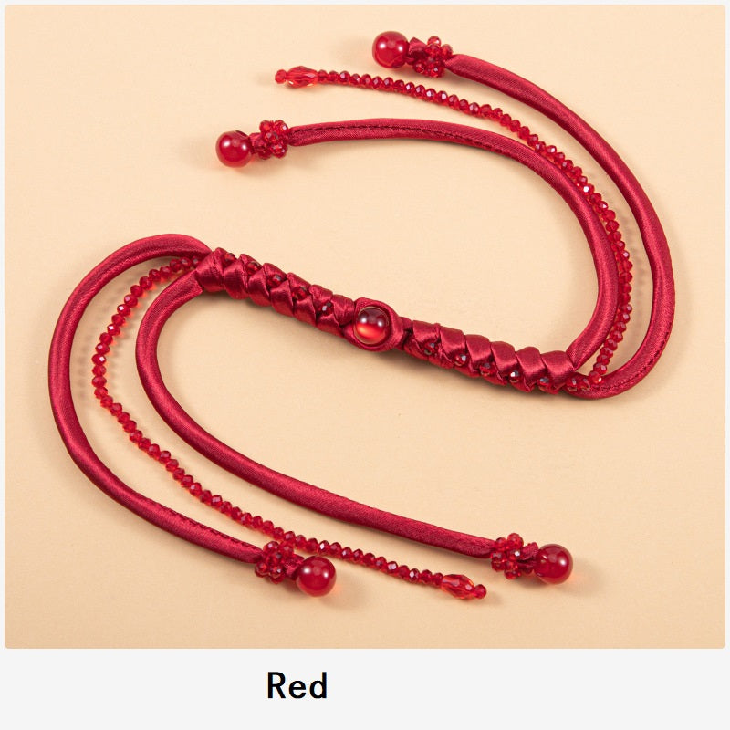Red snake-knot braided cord set with beaded tips and satin knot detail