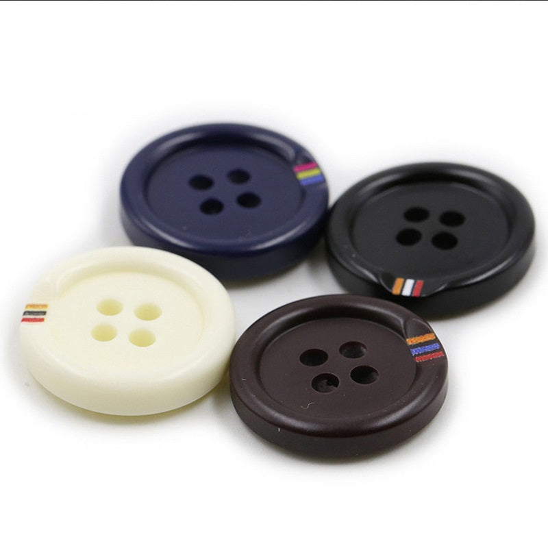 Four-hole round resin buttons set: cream, navy, black, and dark brown