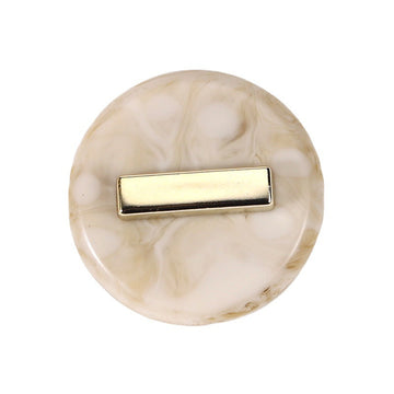 Beige round resin button with gold-tone rectangular front detail