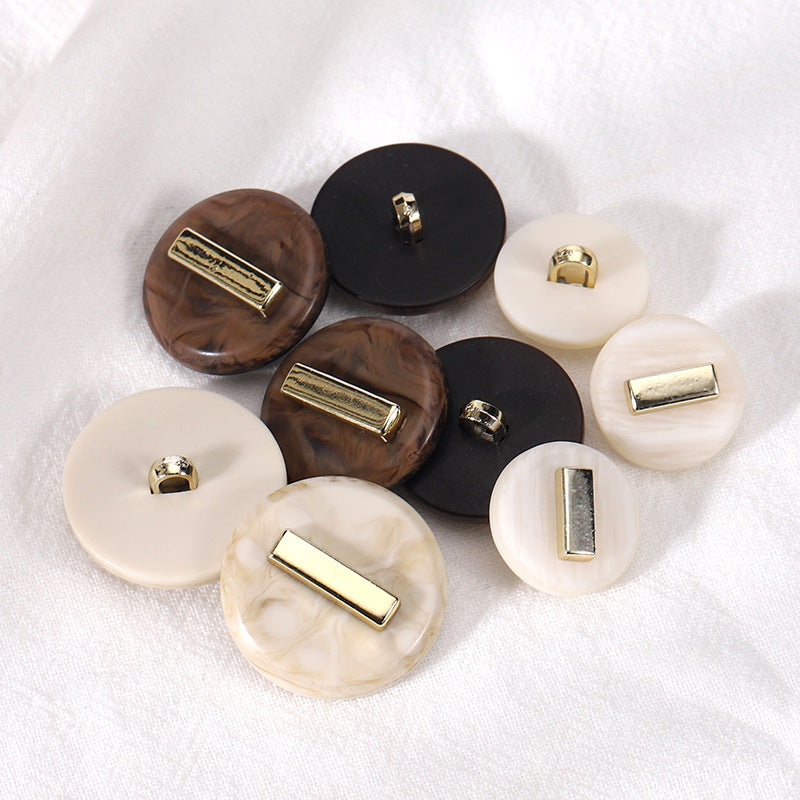 Round resin buttons in beige and coffee, each with gold-tone rectangular face