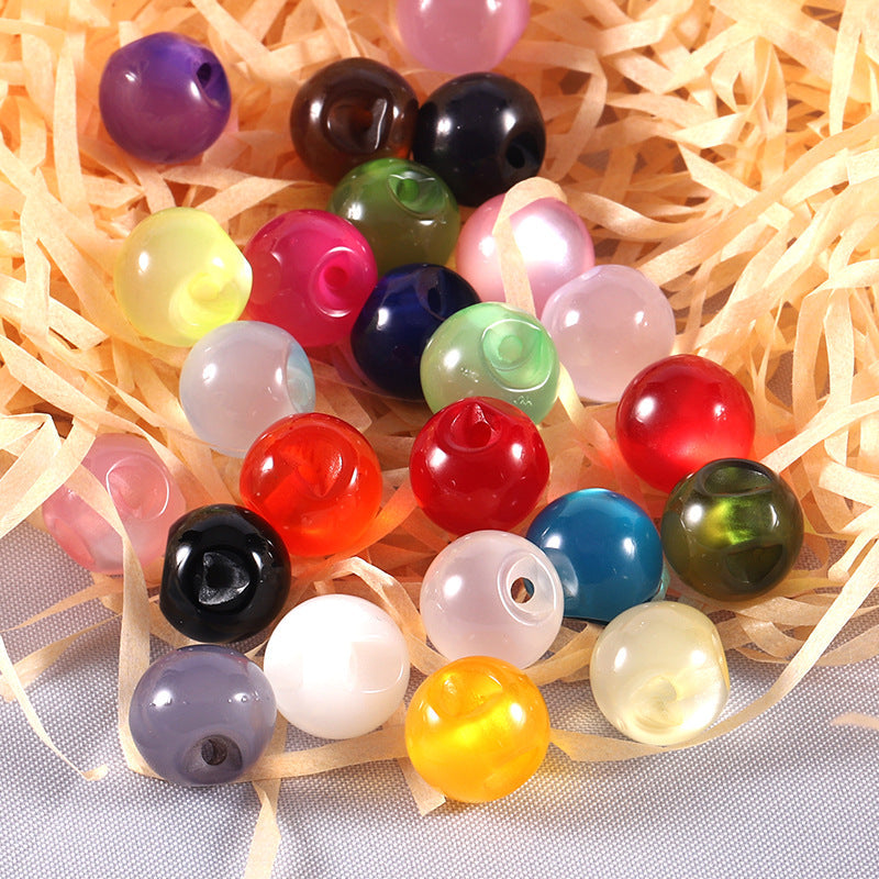 Colorful round resin pearl buttons in assorted shades, shiny glossy finish