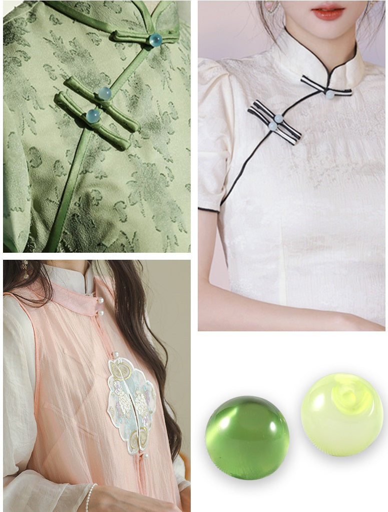 Round green resin pearl buttons with black button details on white garment