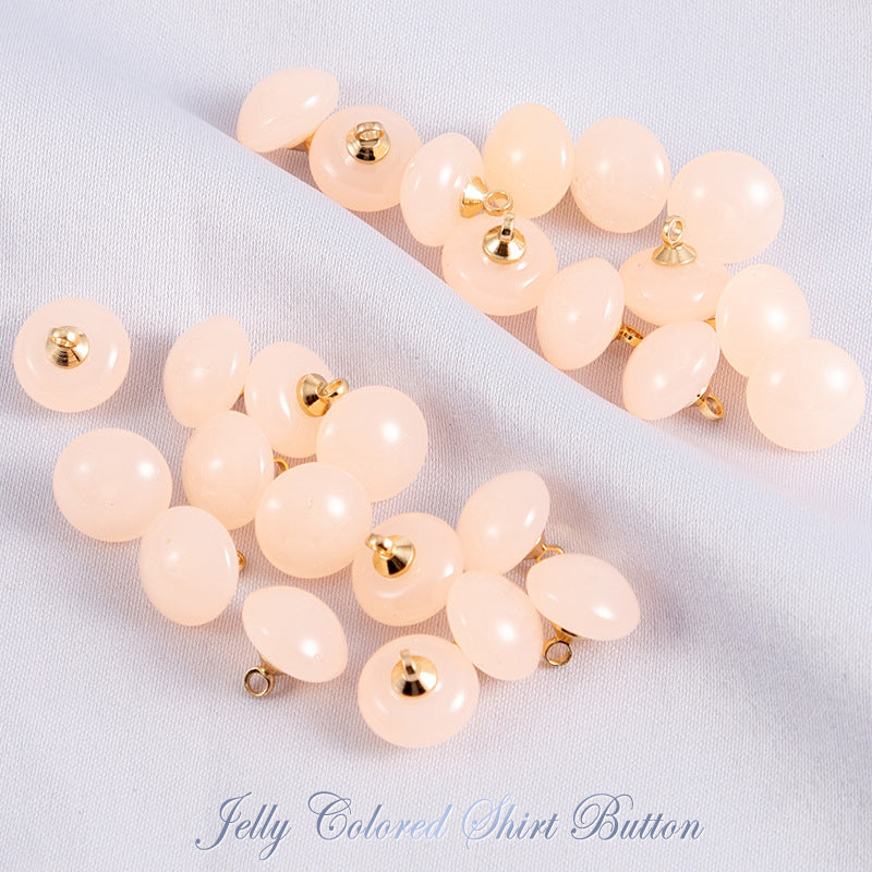 Light pastel jelly resin round shirt buttons with gold-tone shanks in peach and white