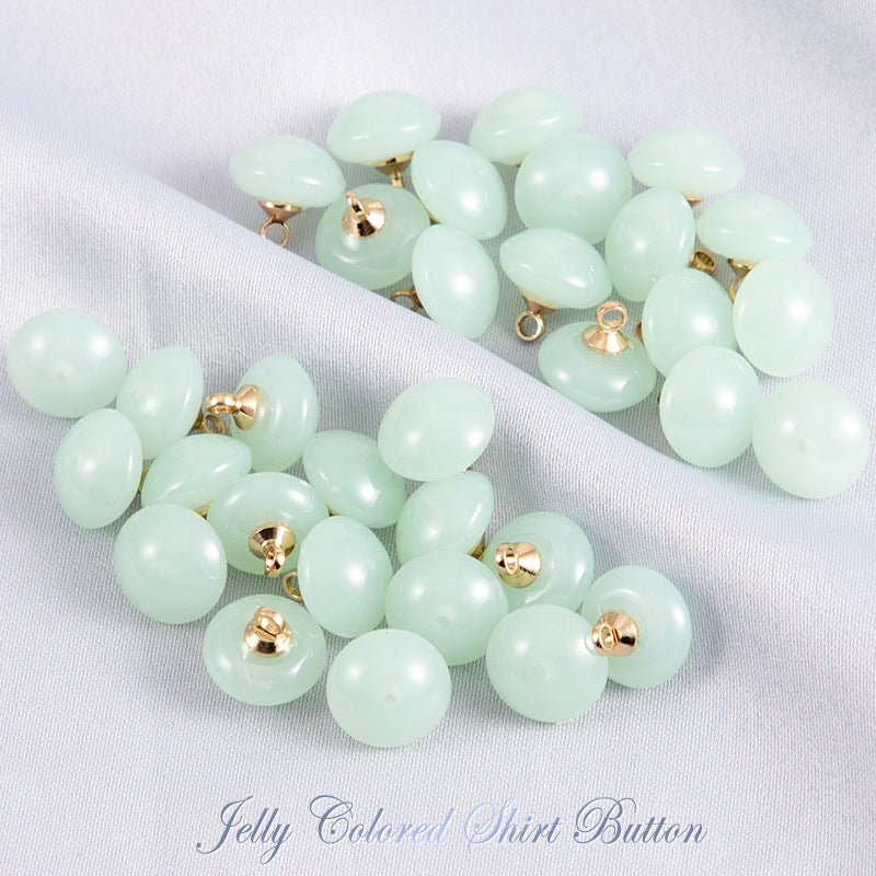 Mint-green round resin shirt buttons, gold-tone loop shank, 2-hole, 50 pcs
