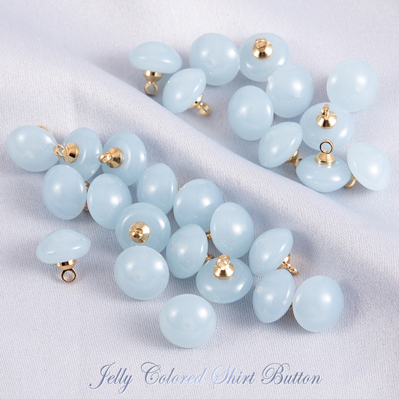 Light-blue round resin shirt buttons, gold-tone loop shank, 2-hole, 50 pcs