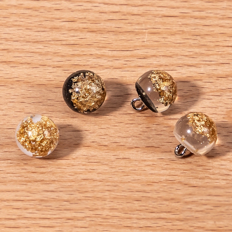 Round resin pearl buttons with gold glitter foil flecks and metal loop shank