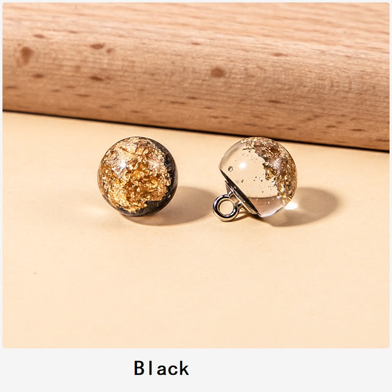 Black resin pearl buttons with gold glitter foil flecks and metal loop shank