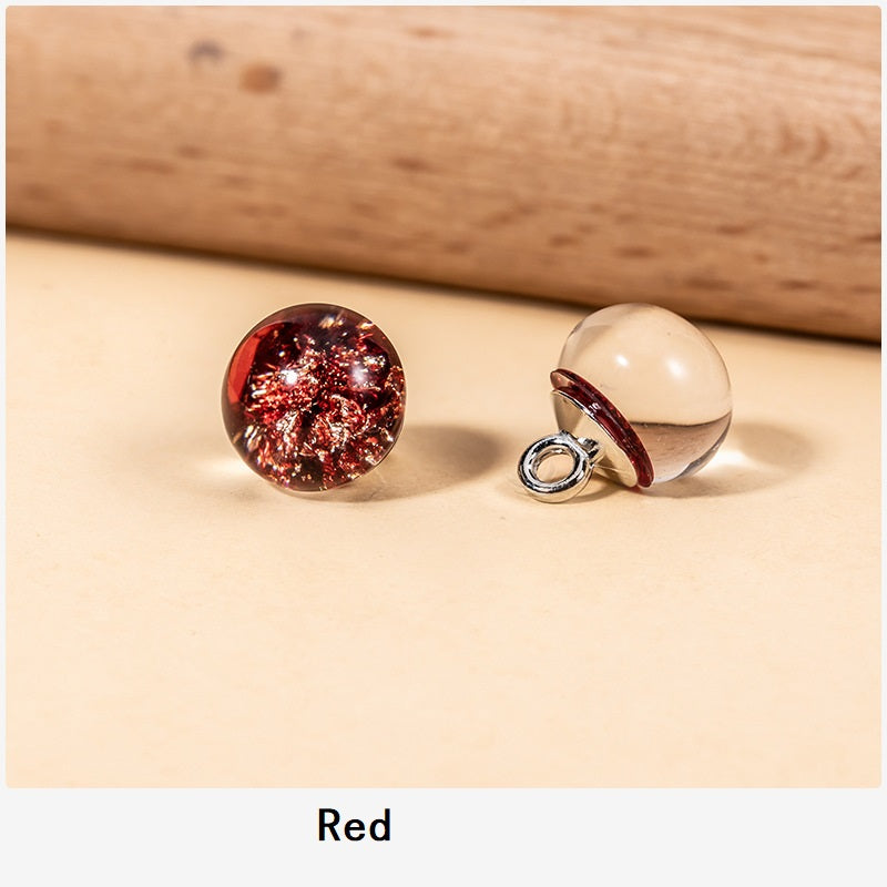 Red resin pearl buttons with gold glitter foil flecks and metal loop shank