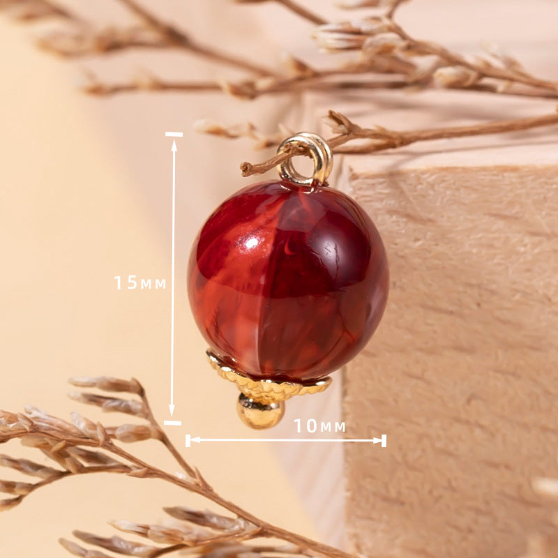 10mm red acrylic bead cheongsam button with gold loop and floral base, 15mm length