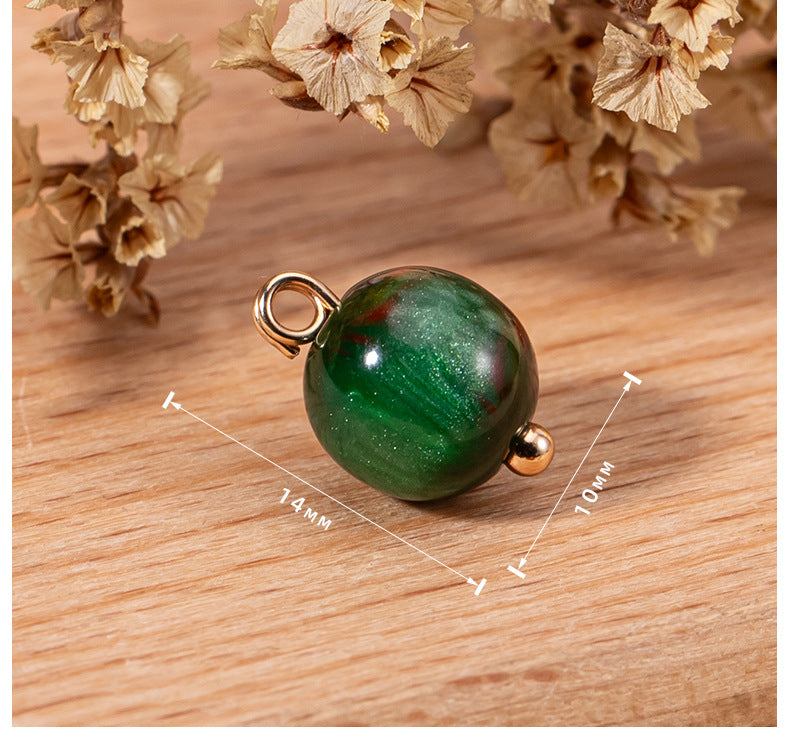 Green round bead button, pearlescent resin, metal loop; approx 14 mm by 9 mm