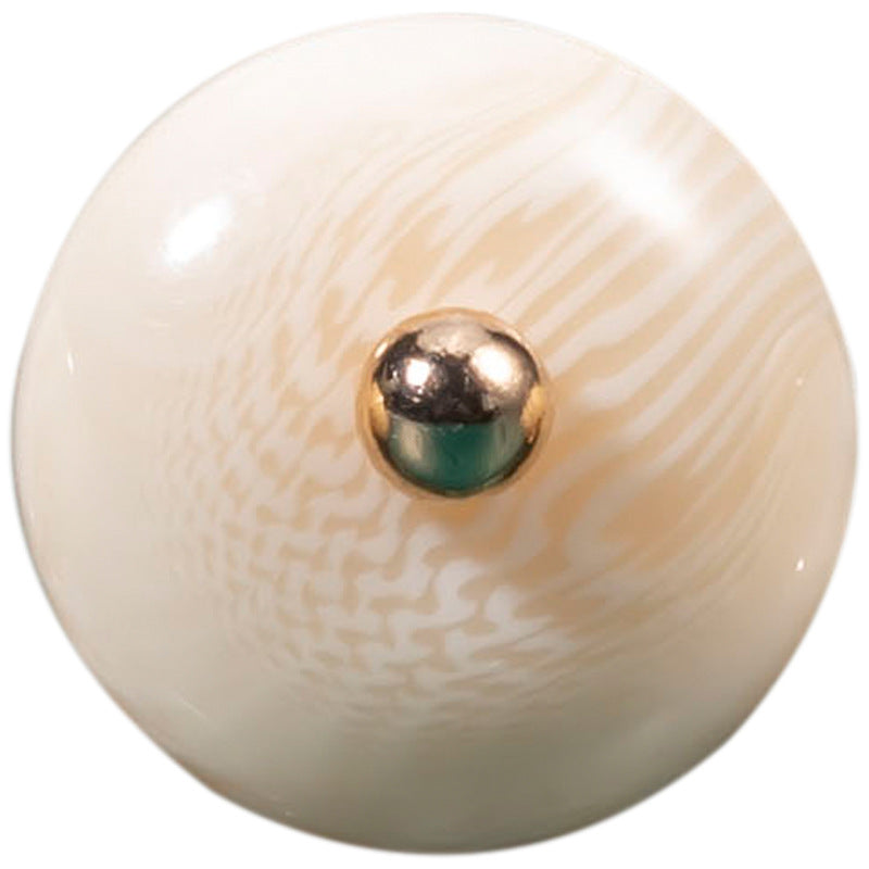 White oval resin bead button with gold-tone round center
