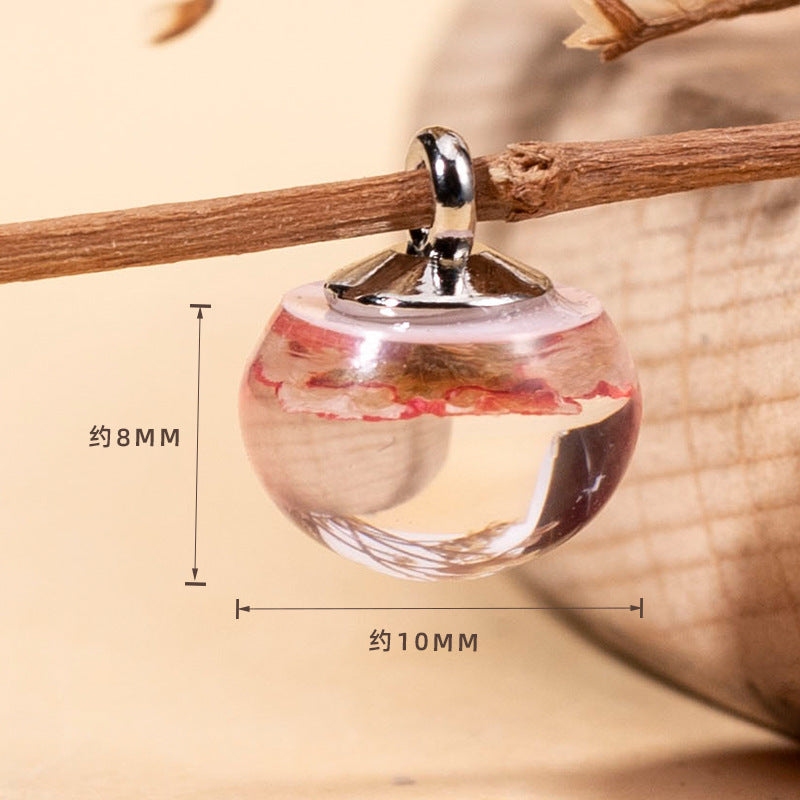 Transparenter Resin-Blütenknopf mit rotem getrocknetem Blumenmuster, ca. 10mm