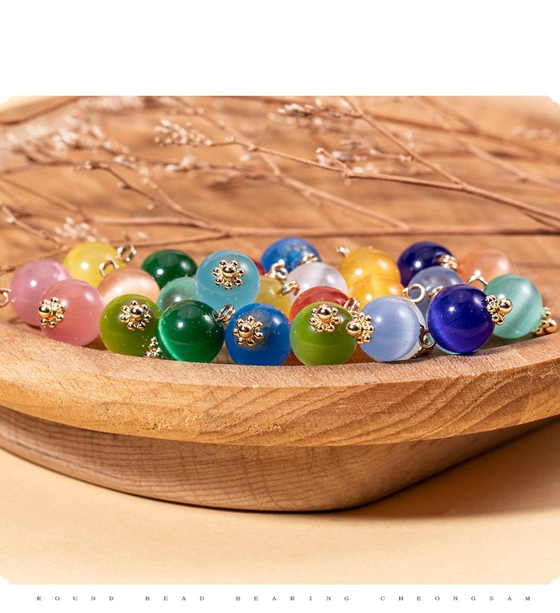 Round cat’s eye stone bead buttons, mixed colors with gold-tone mounts