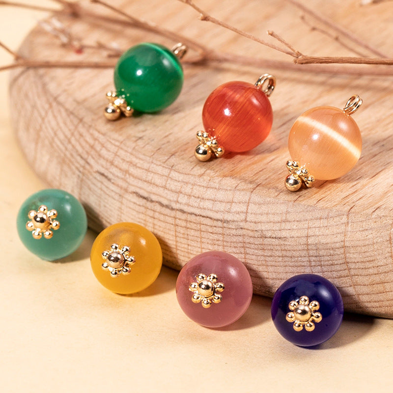 Set of round cat’s eye stone buttons: green, orange, pink, blue, gold-tone mounts