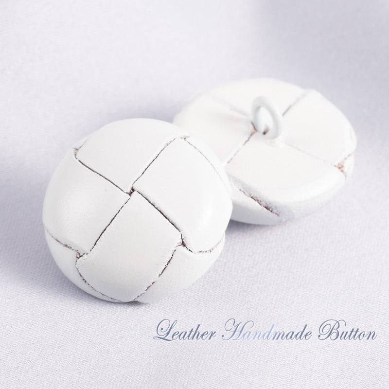 White leather sweater buttons with stitched cross panels and loop shank (pair)
