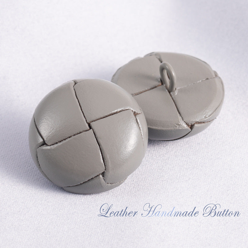 Gray leather sweater buttons with stitched cross-panel design and loop shank (pair)